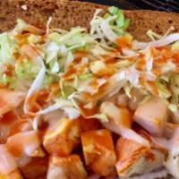 Buffalo Chicken Sandwich · Grilled chicken, Swiss cheese, lettuce and red onions smothered with Frank's hot sauce and R...