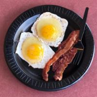 2 Eggs & Bacon · The perfect breakfast! 2 eggs and a couple strips of bacon.