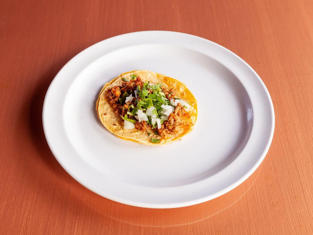 Meat Taco · Two Grilled Corn Tortillas Filled With Your Choice of Meat, Topped With Onions and Cilantro