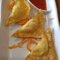 Crab Rangoons · 3 pieces. Crabmeat and cream cheese wrapped in wonton shells. Served with sweet chili sauce.