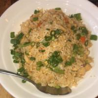 Chicken fried rice  · With egg and vegetables 