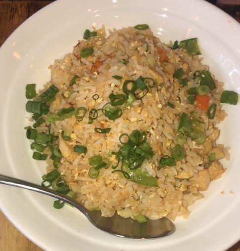 Chicken fried rice  · With egg and vegetables 