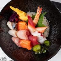 Chirashi Deluxe · Assorted raw fish on top of a box of seasoned sushi rice. Served with miso  soup or salad.