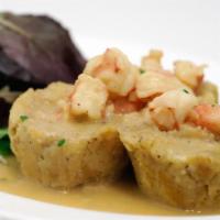 Baby Fongo · Fried mashed green plantain served with garlic sauce and shrimp.
