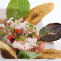 Shrimp and Fish Ceviche · Shrimp and fish in lemon sauces served with fried plantain.
