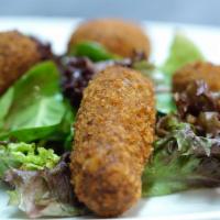 Seafood Croquettes · Rolled in breadcrumbs and fried. 