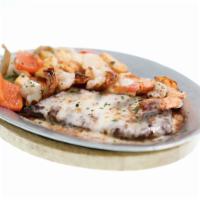 Surf & Turf · Fresh combination of shrimp and steak, sautéed with cheese , mushrooms and tomatoes in wine ...