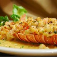 King Lobster · Lobste tail filled with shrimp in garlic sauce and wine sauce. Cola de langosta rellena de c...