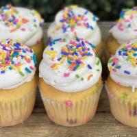 Birthday Cake Cupcakes · Funfetti cake loaded with sprinkles, frosted in vanilla buttercream and garnished with rainb...