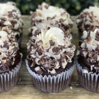 Hot Cocoa Cupcakes · Rich cocoa cake, dipped in chocolate ganache, frosted in marshmallow buttercream and chocola...