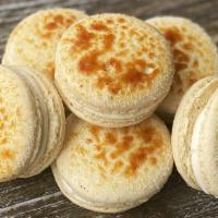 Creme Brulee Macarons · French vanilla macaron shell filled with caramel and bruleed.