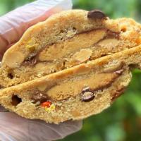 Stuffed Reese's Peanut Butter Cup Cookie · This massive Reese's peanut butter cookie is loaded with Reese's Pieces, Reese's peanut butt...