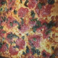 Grandma Pizza · Mozzarella on bottom and tomato basil sauce on top.