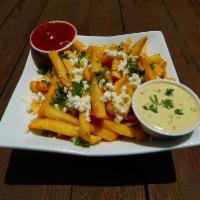 Feta Fries · Seasoned fries with melted feta cheese and garnished with parsley. Served with garlic herb a...
