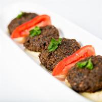 Falafel Appetizer · Garbanzo beans with fresh herbs and spices. Served with tahini. Vegetarian.