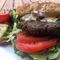 Falafel Burger · A delicious blend of Garbanzo bean with fresh herbs and spiced patty, served with tomatoes, ...