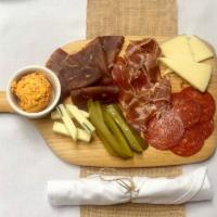Balkan Meze Plate · Chef's selection of dry meat and cheese served with homemade breadsticks.