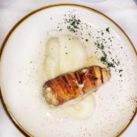 Chicken Wrapped in Bacon · Chicken breast stuffed with ham and cheese, rolled in bacon and grilled.