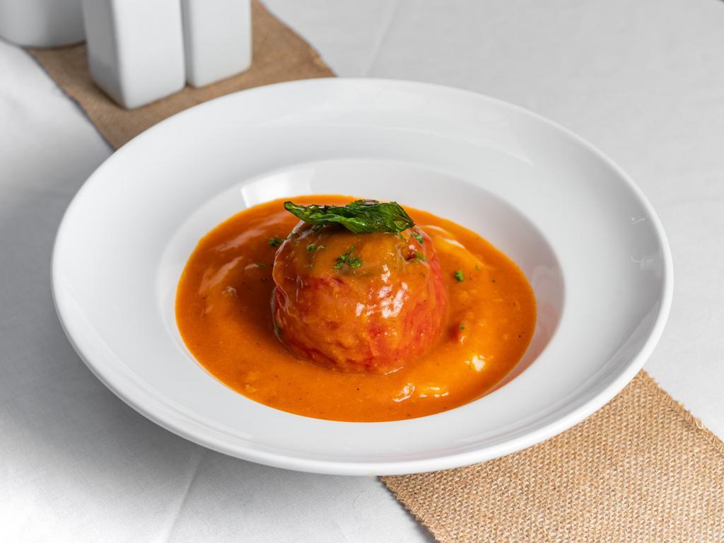 Stuffed Peppers · Peppers stuffed with ground meat, rice, and spices, served with mashed potatoes.