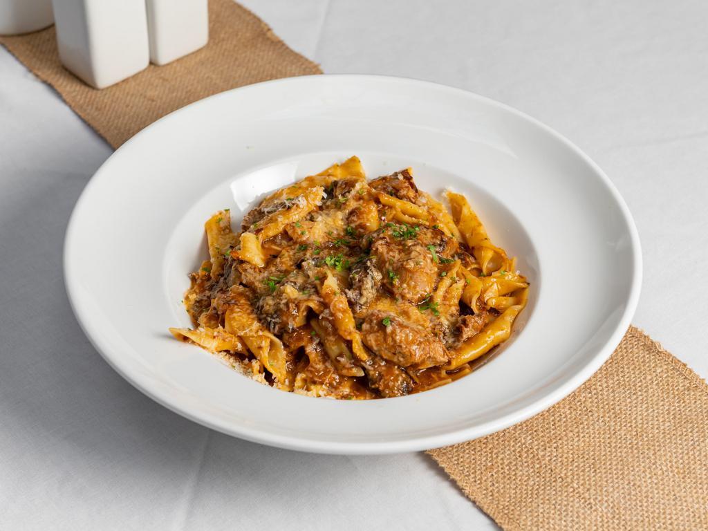 Fuzi Pasta with Veal · Homemade bow tie pasta served with veal ragu.