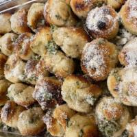 Garlic Knots · Rolled baked garlic bread.