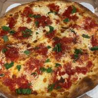Margherita Pizza · San Marzano tomato pizza sauce, topped with fresh mozzarella, basil, and extra virgin olive ...