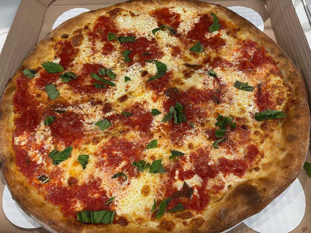 Margherita Pizza · San Marzano tomato pizza sauce, topped with fresh mozzarella, basil, and extra virgin olive oil. Gluten-free.