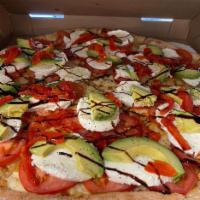 Avacado di Casa Pizza · Thin crust round pie topped with fresh mozzarella, tomatoes, basil drizzled with extra virgi...