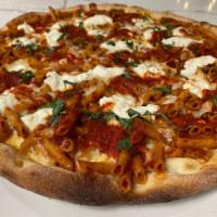 Baked Ziti Pizza · Topped with baked ziti with ricotta, mozzarella, and our tomato sauce.