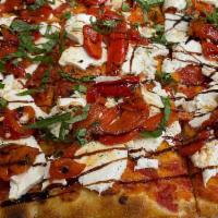 Crostino Pizza · Thin crust square pie topped with fresh mozzarella, tomatoes, basil, and extra virgin olive ...