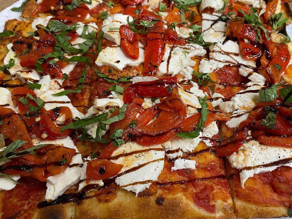 Crostino Pizza · Thin crust square pie topped with fresh mozzarella, tomatoes, basil, and extra virgin olive oil. Vegan.