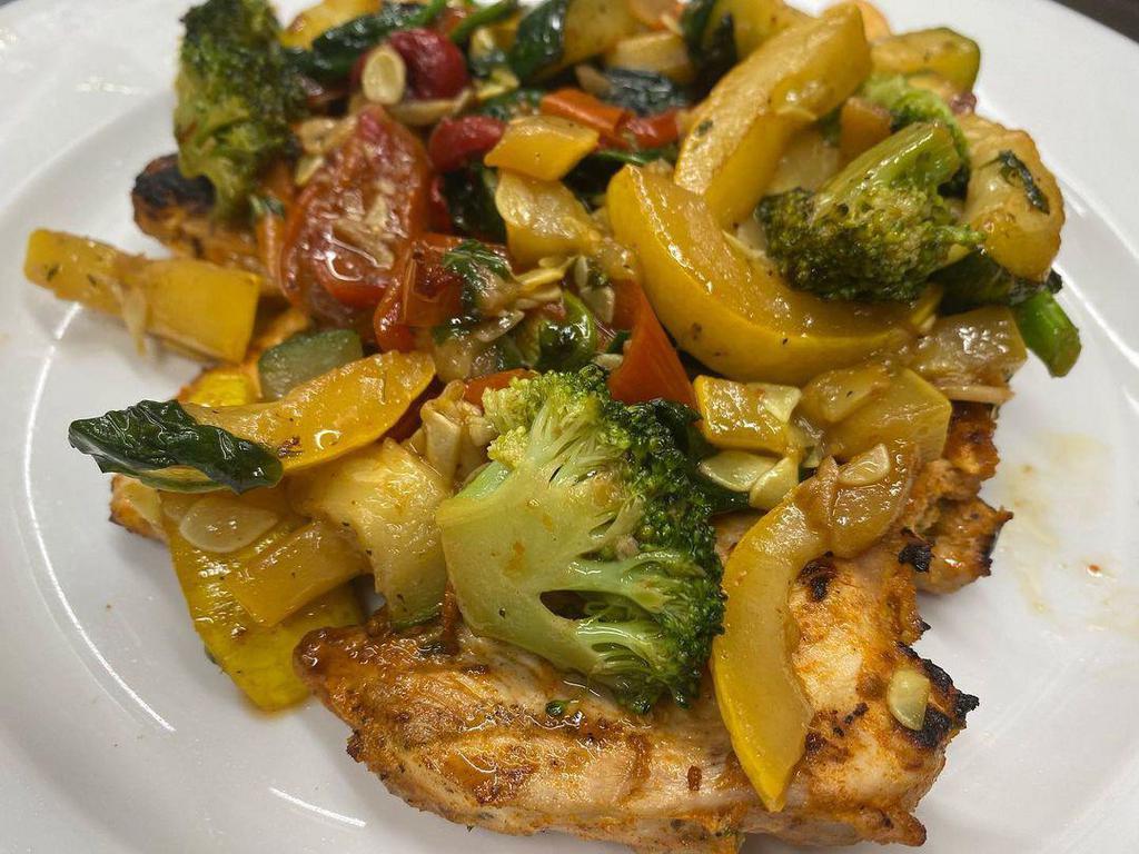Grilled Chicken Primavera · Grilled chicken marinated with balsamic vinegar topped with fresh vegetables. Gluten-free.