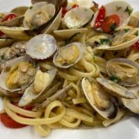 Linguini alla Vongole · Fresh clams sauteed in garlic and oil, white wine a cherry tomatoes. Gluten-free.