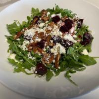 Goat Cheese Salad · Arugula goat cheese, pickled beets, pecans, and our house Italian style dressing. Gluten-free.