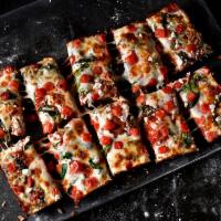 Mediterranean Pizza · Pizza sauce, premium mozzarella, tomatoes, feta and spinach.