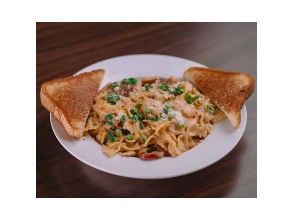 Zydeco Pasta · Shrimp, sausage, and Cajun cream sauce over bowtie pasta. Sprinkled with Green Onions and served with Texas Toast.
