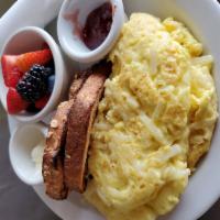 Hash Brown Omelette · Three egg omelette with hash browns mixed in.  Served with toast and a small side of fruit. ...