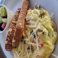 Farmer's Market Omelette · Three egg omelette with mushrooms, yellow squash, zucchini, red bell peppers, and Parmesan c...