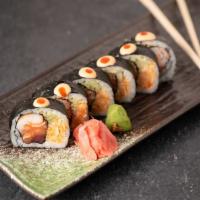 Paradise Roll · salmon,tuna and kani wrapped inside out in seaweed wrapped into another roll with Cucumber a...