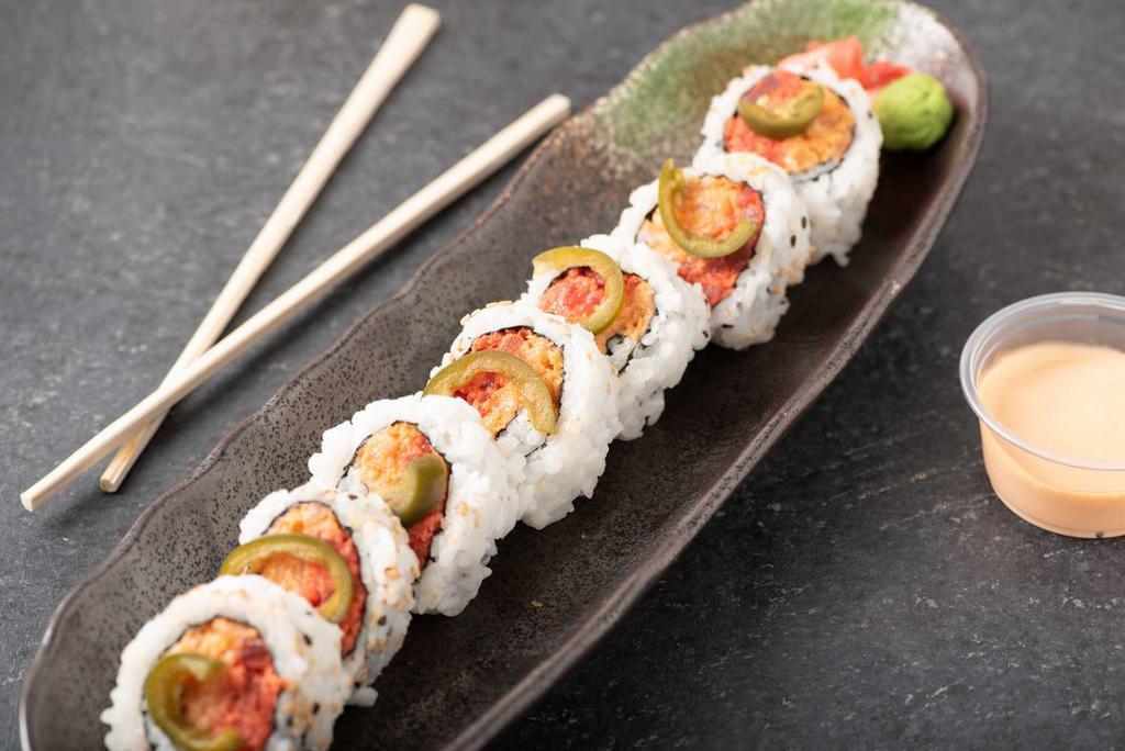 Mexican Roll · Spicy tuna, spicy salmon, crunch topped with jalapeno.