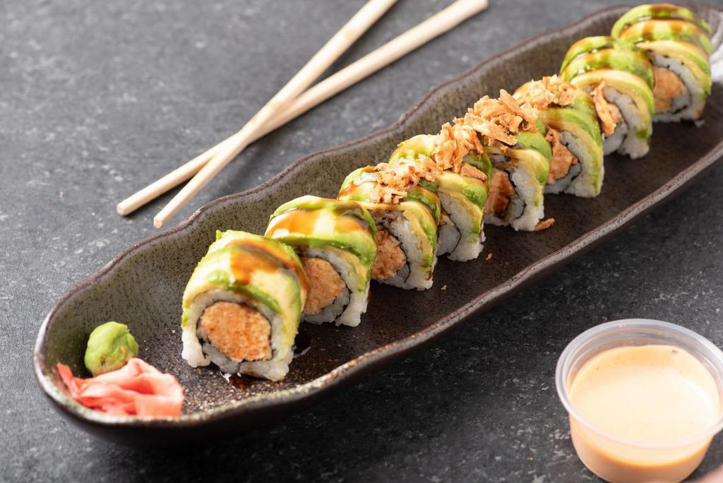 Tiger Roll · Spicy kani, crunch, wrapped with avocado topped with crunch and drizzled with sweet sauce.