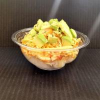 Kani Salad · Shredded kani on a bed of rice with thinly shredded cucumber tossed in a light mayo based dr...