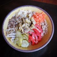 Roasted Artichoke Grain Bowl · Roasted artichoke, mozzarella, carrots, tomato, pickles, bean sprouts and citronette dressing.