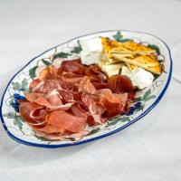 Italian Charcuterie and Cheese with Piadina Bread · A Selection of Cured Italian Meats and Cheeses