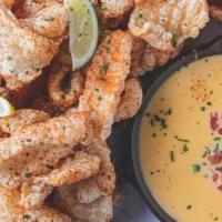 Cracklins and Queso · Seasoned cracklins or house-made chips served with queso. Add crawfish queso for an addition...