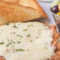 Country Fried Protein · Hand-battered and deep-fried chicken breast or steak topped with homemade cream gravy. Choic...