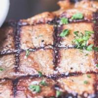 Pork Chops · 2 pieces 5 oz. pork chops grilled or country-fried with creamy gravy. Choice of 2 sides.