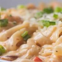 New Orleans Pasta · Fettuccine noodles, shrimp, crawfish tails, andouille sausage, and fresh veggies tossed in a...