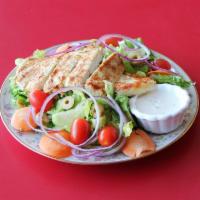 Grilled Chicken Salad · Salad with chicken that has been cooked on a rack over a grill.