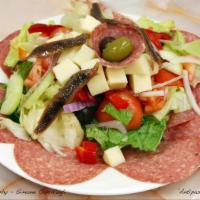 Antipasto Salad · Cucumbers, tomato, pimiento, olives, genova, salami, provolone cheese, anchovies and oil and...